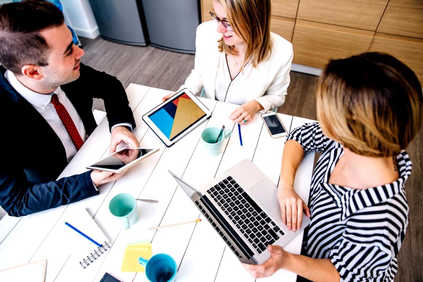 Professional consultation reviewing financial automation workflows and system integration possibilities